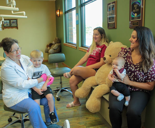 Patients and a doctor in The Kidds Place waiting room